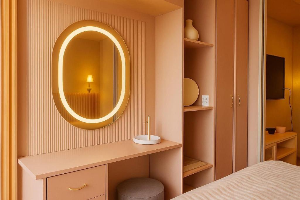 a bathroom with a sink and a mirror on a wall at Meraki Urban in Davao City