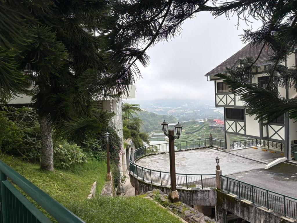 a building with a view of a body of water at Copthorne Hilltop Resort, Sunrise n Mountain view at Cameron Highlands in Brinchang