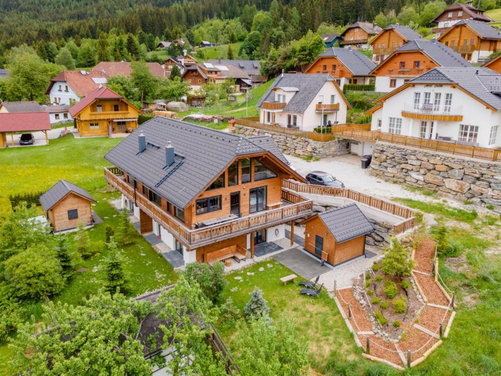 an aerial view of a large house in a village at Alpinn Wellness 1 in Sankt Margarethen im Lungau