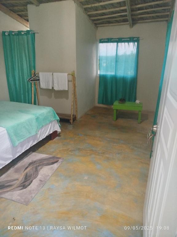 En eller flere senge i et værelse på Parador tropical