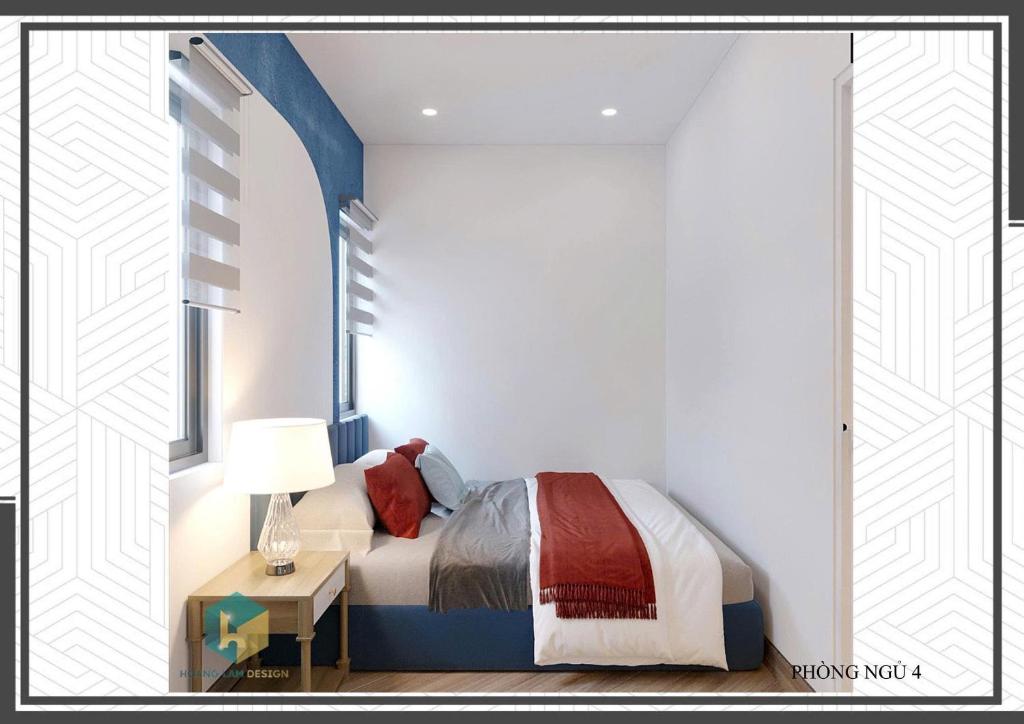 a bedroom with a bed and a table with a lamp at Villa Malibu Tropicana Hồ Tràm in Xuyên Mộc