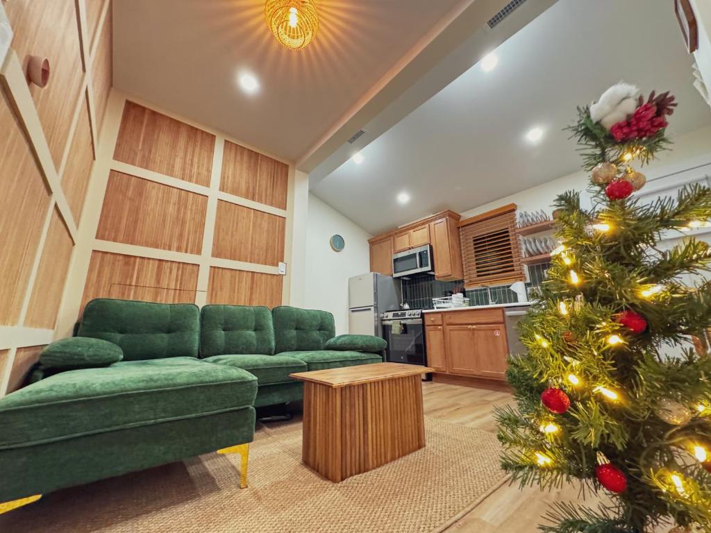 a living room with a christmas tree in it at Stylish 2 BR 1 BA Apartment - Steps to the Ocean - Hidden Gem in Wildwood