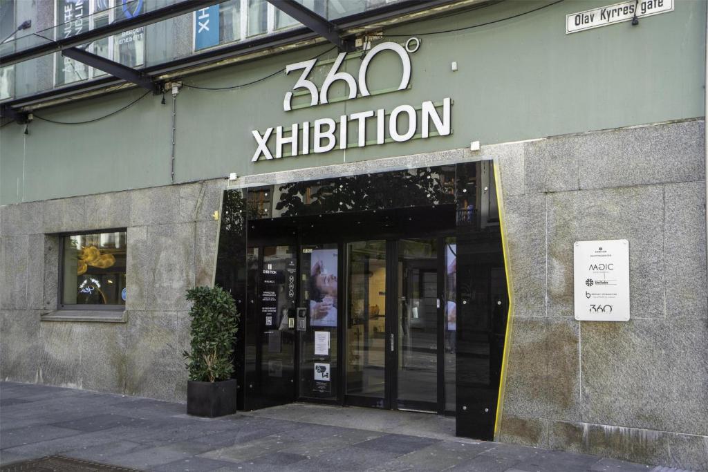 a building with aeliption sign on the front of it at Prize by Radisson, Xhibition Bergen City in Bergen