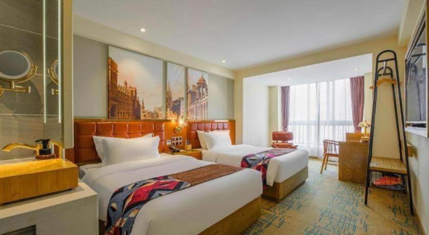 Ένα ή περισσότερα κρεβάτια σε δωμάτιο στο James Joyce Coffetel· Xianyang Renmin Road Central Square Store