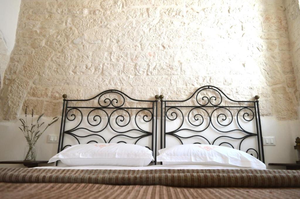 Posteľ alebo postele v izbe v ubytovaní Masseria Faraone