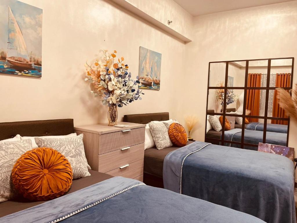 Postel nebo postele na pokoji v ubytování Hope Residences by SoCaRi