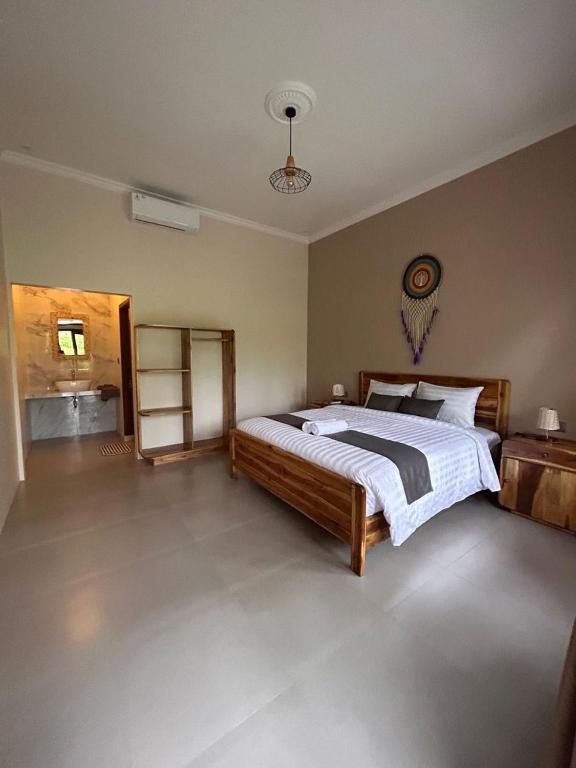 En eller flere senge i et værelse på Greenfield-Lombok