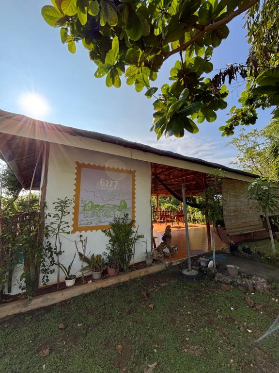 a building with a sign on the side of it at 6227 Guesthouse in San Juan