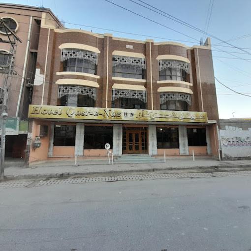 a building with a sign on the front of it at Hotel Qasr-e-Naz in Dargai