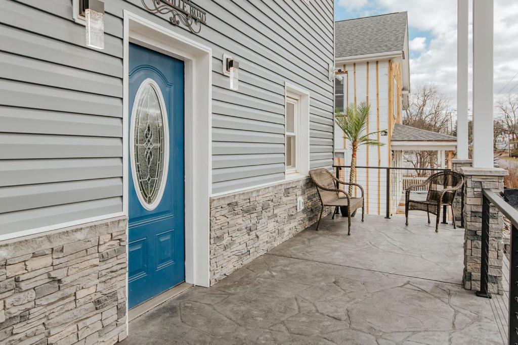 a blue door on the side of a house at Fishersville Oasis in Fishersville