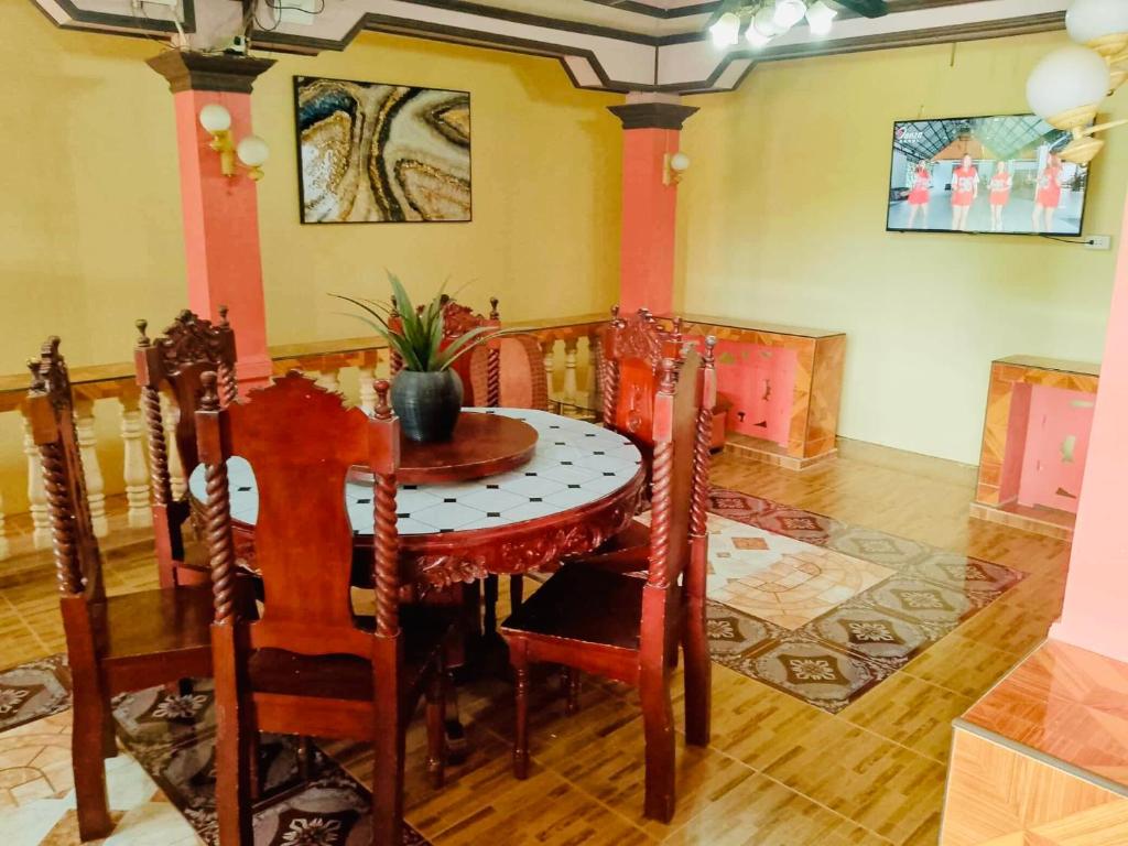 a dining room with a table and chairs at Z House of Guests 6- Mambago B, Samal Davao Del Norte in Samal