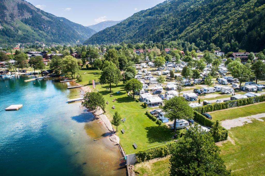 an aerial view of a park next to a river at Chalets Camping Brunner am See in Döbriach