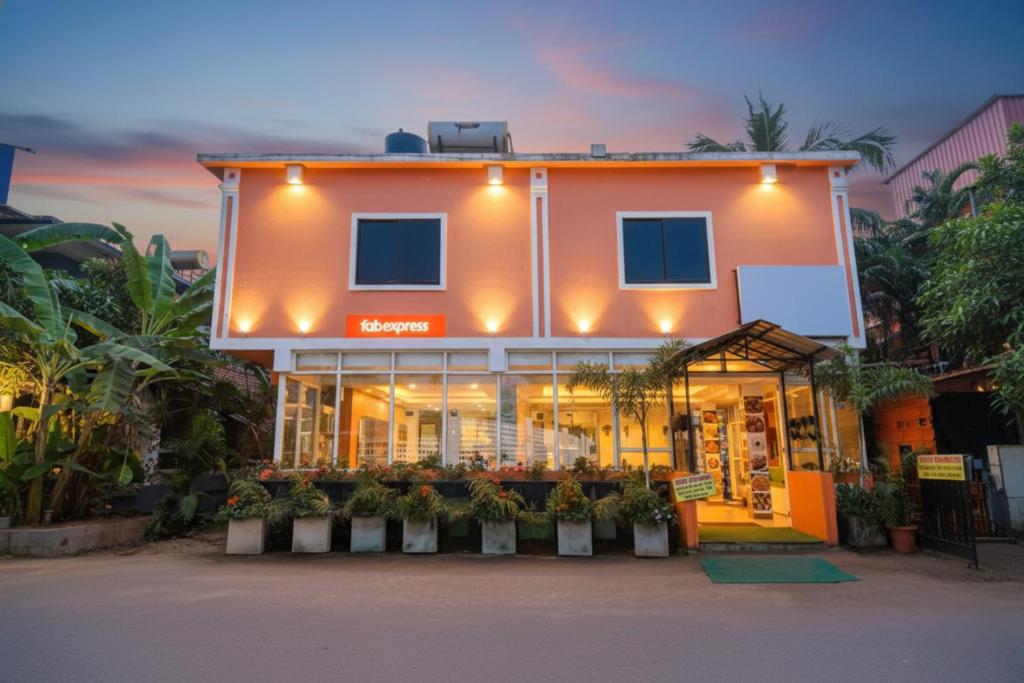 a store front of a building at dusk at Via Shanel Beachside Resort - Tito's lane, Baga Beach in Baga