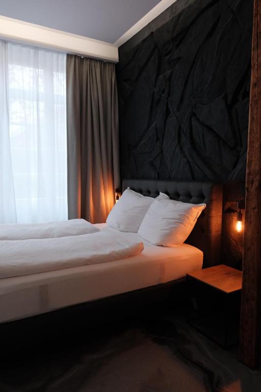 Кровать или кровати в номере BillHills Boutique & Design Aparthotel