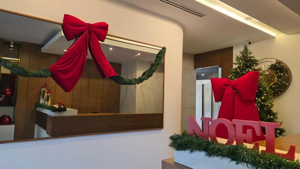 a store with christmas wreaths and a sign that says not at Mateus Hotel & Pool in Jounieh