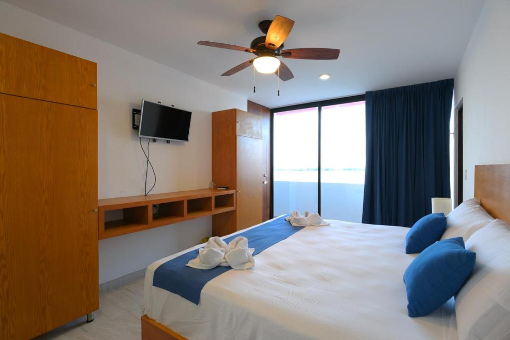 Postel nebo postele na pokoji v ubytování Yuum Ha Boutique Hotel