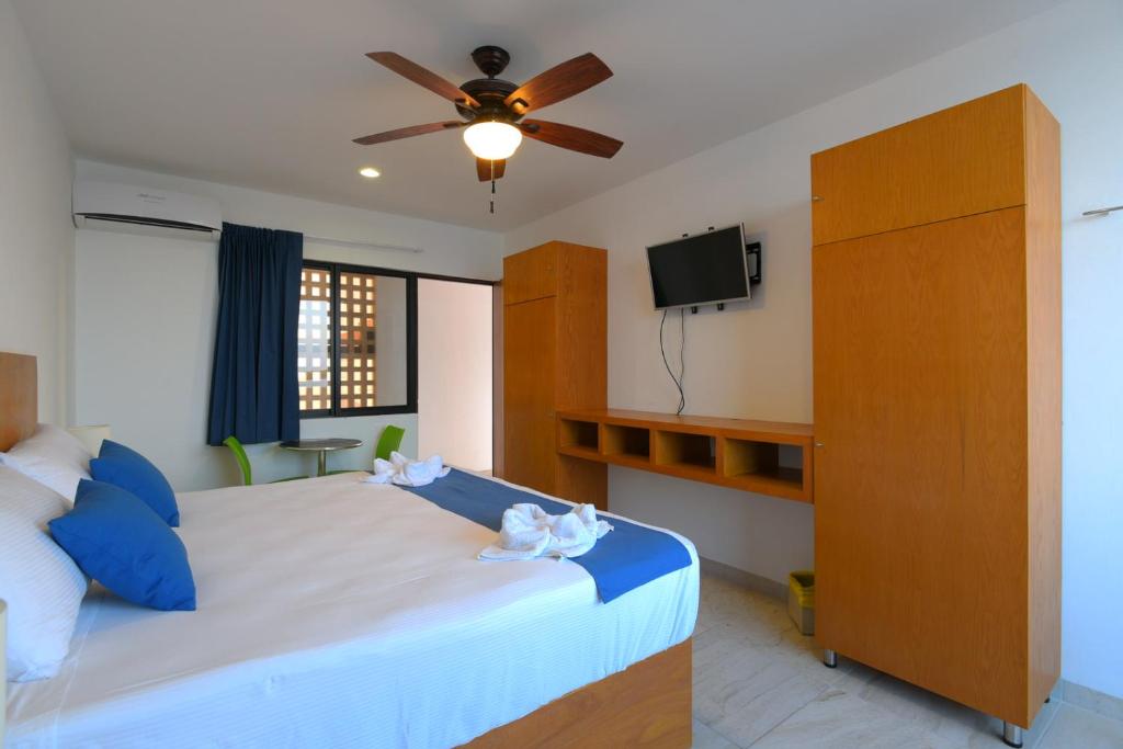 Postel nebo postele na pokoji v ubytování Yuum Ha Boutique Hotel