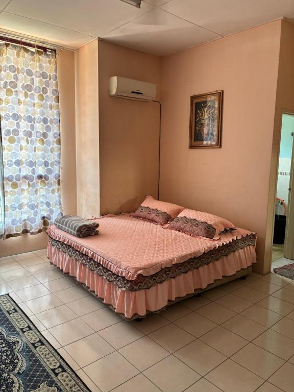 Postel nebo postele na pokoji v ubytování Neeta Homestay