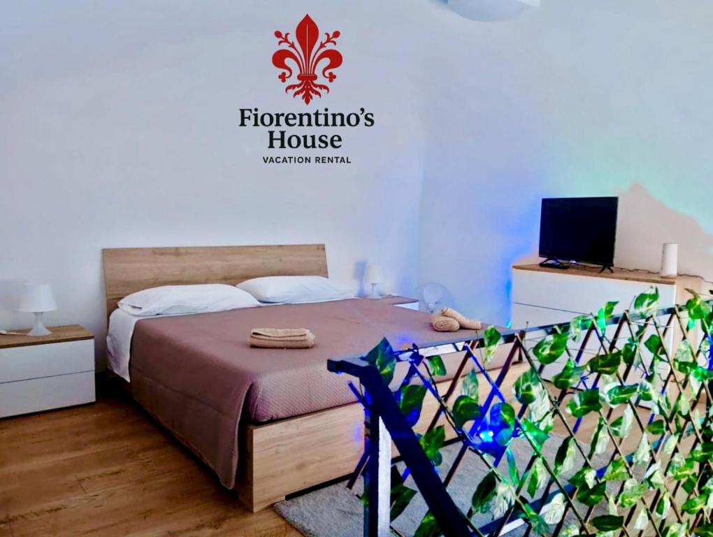 Ένα ή περισσότερα κρεβάτια σε δωμάτιο στο Fiorentino's House