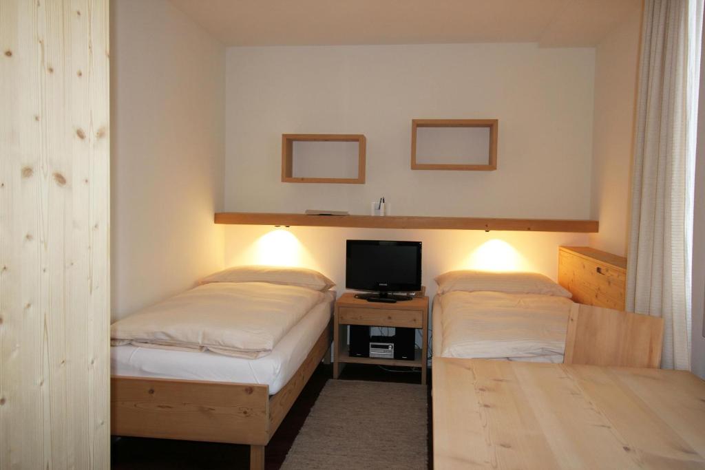 Postel nebo postele na pokoji v ubytování Residenza Lagrev Studio Nr 013 - Typ 10B - Hochparterre - Ost