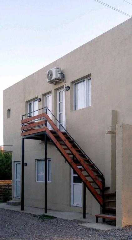 a staircase on the side of a building at Brusa3 in Las Grutas