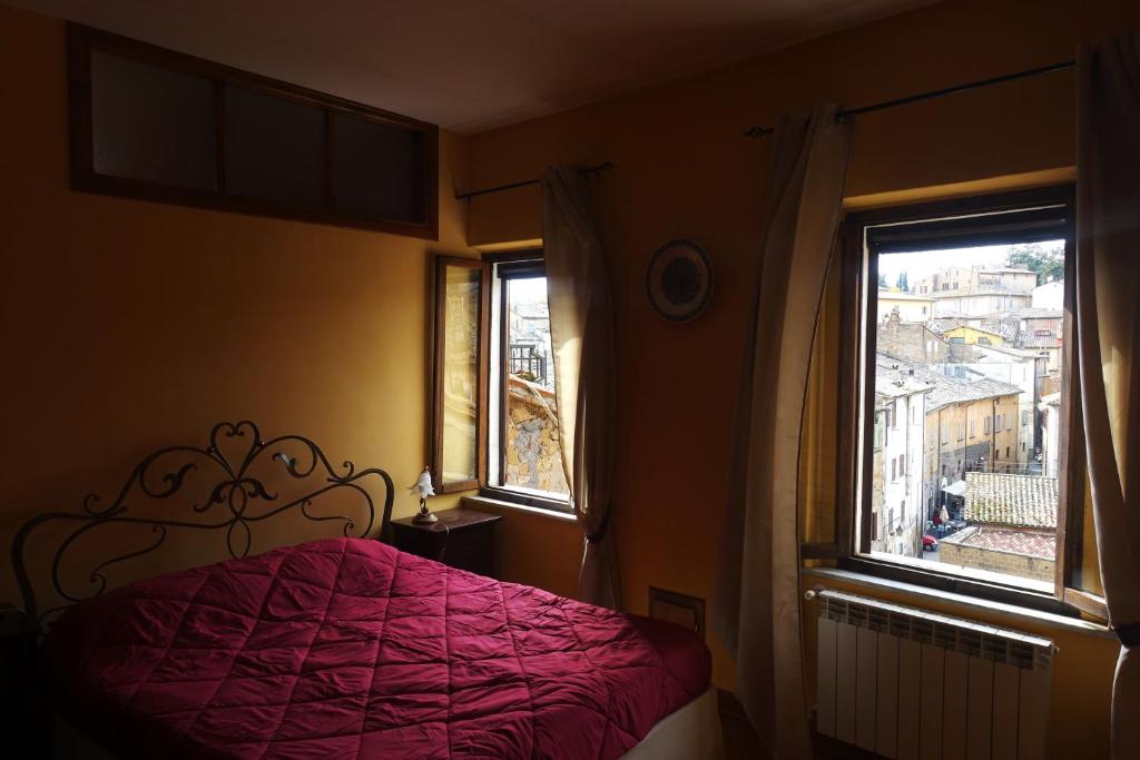 Ένα ή περισσότερα κρεβάτια σε δωμάτιο στο Torre Verde Acquapendente