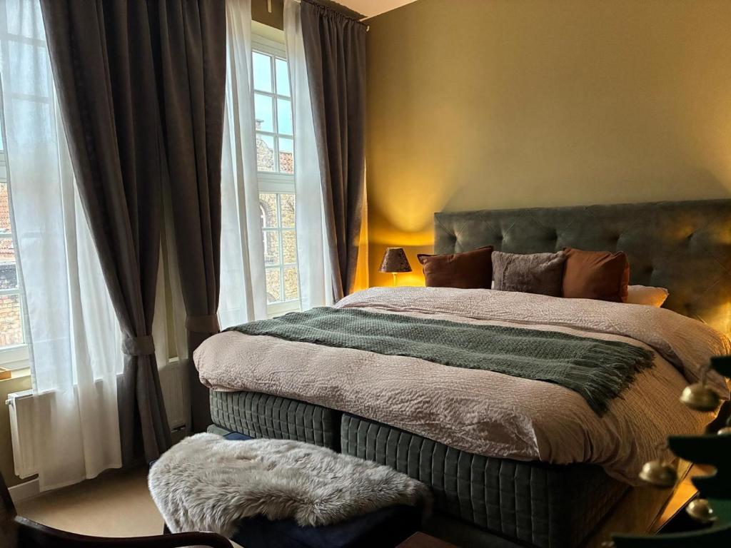 Ένα ή περισσότερα κρεβάτια σε δωμάτιο στο Si brugge