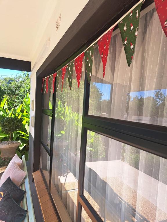 a window with christmas ornaments on it at 68Warren in Vryburg