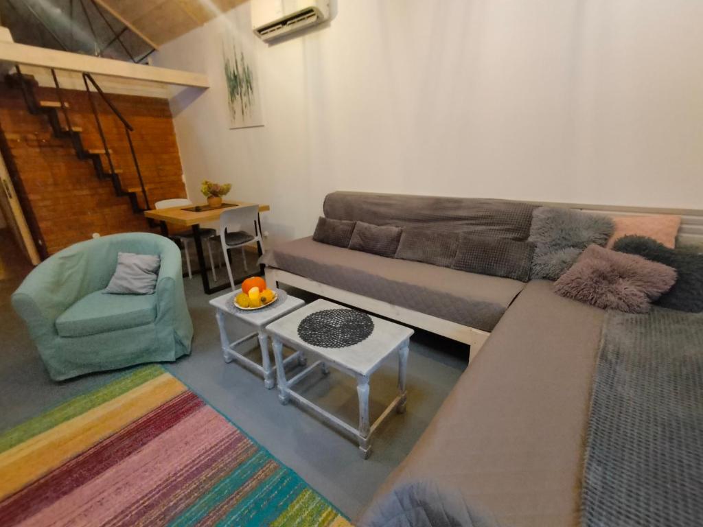 a living room with a couch and a table at Wolna Chwila in Maków