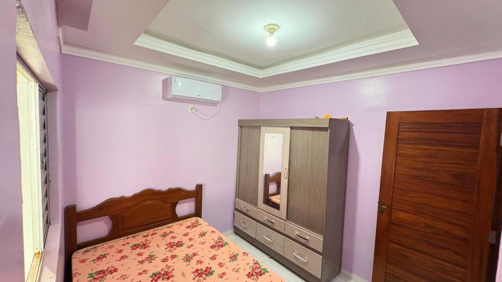 Giường trong phòng chung tại Casa da família