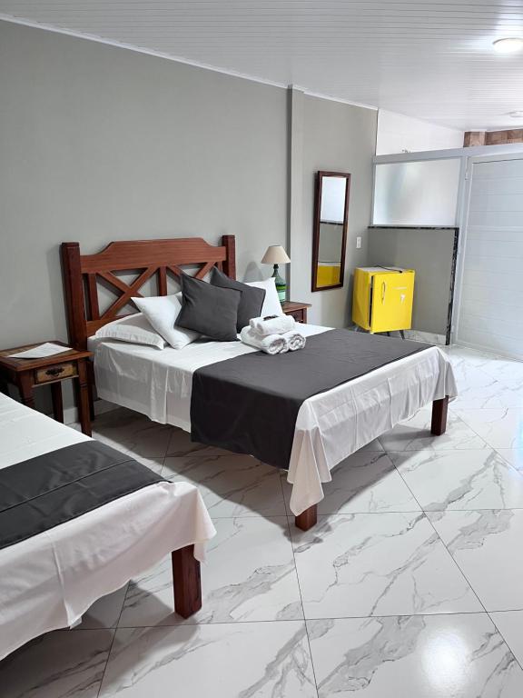 Postel nebo postele na pokoji v ubytování Hotel Lumiar