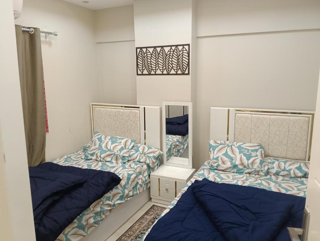 En eller flere senge i et værelse på شقة فندقية غرفة واحدة