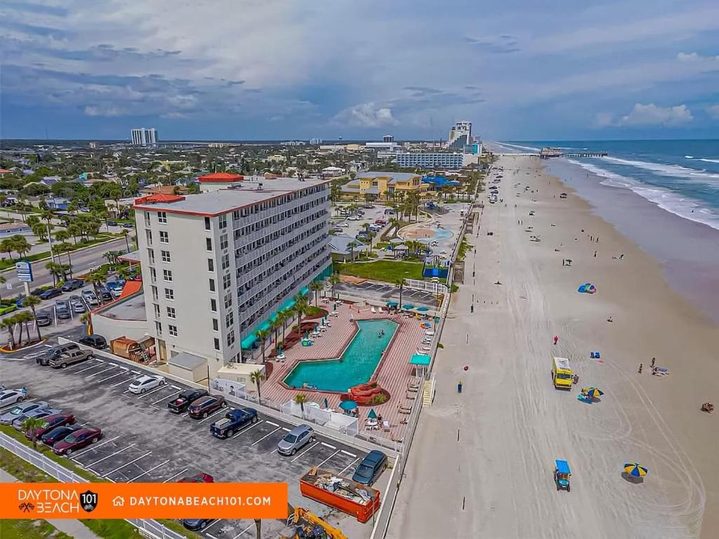an overhead view of a beach with a hotel and the ocean at Amazing Studio Steps Away From The Atlantic Ocean! in Daytona Beach