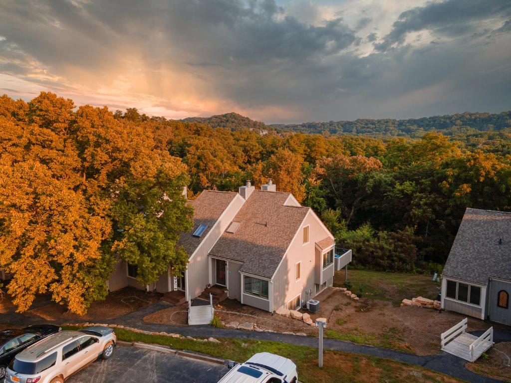 an aerial view of a house with cars parked in a parking lot at Hideaway Cove in Galena