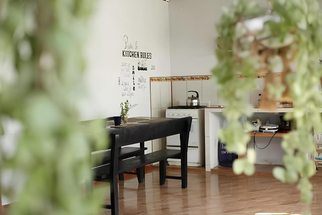 a black table in a room with a kitchen at Homestay Tarapoto in San Antonio