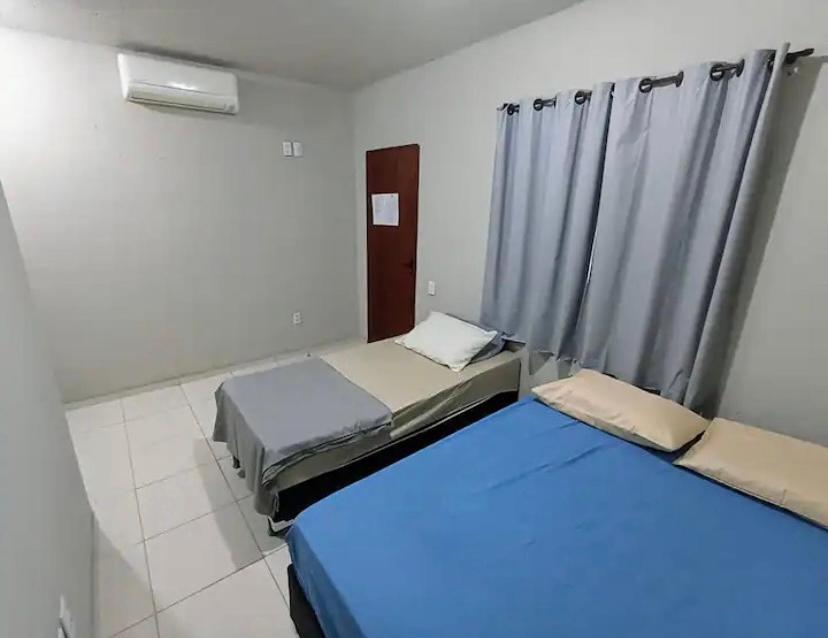 Ένα ή περισσότερα κρεβάτια σε δωμάτιο στο Casa do Vento - 100mts do mar