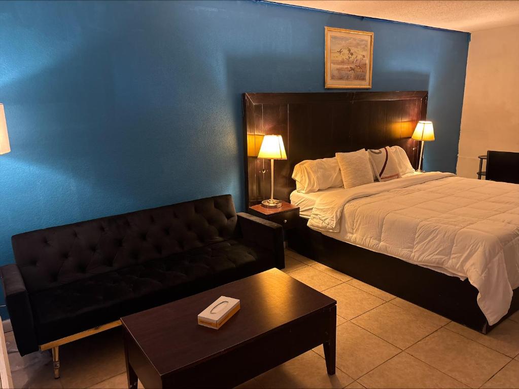 Ένα ή περισσότερα κρεβάτια σε δωμάτιο στο America's Best Value Inn