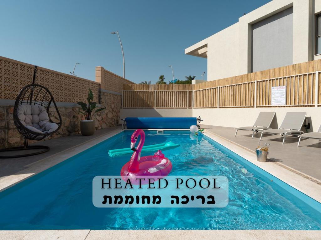 Bazén v ubytování DreamyRent Aqua Sol Eilat nebo v jeho okolí