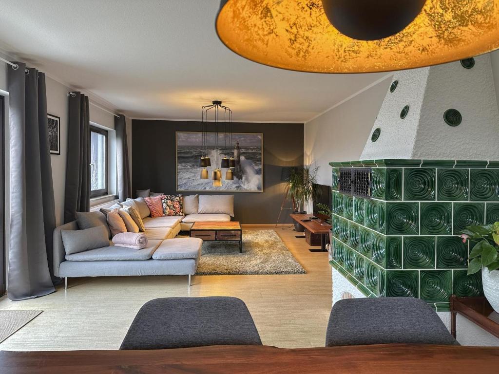 a living room with a couch and a table at Böhmerwaldnest in Schönsee