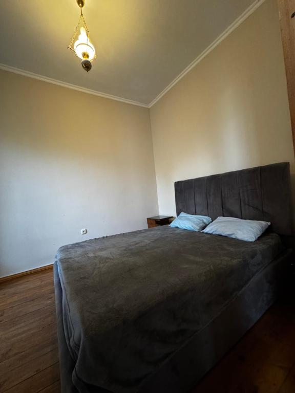 a bedroom with a large bed in a room at Vintage Villa Mitskheta in Mtskheta