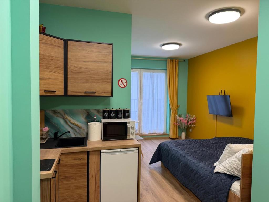 Køkken eller tekøkken på Rumia Apartment by JumpInHere