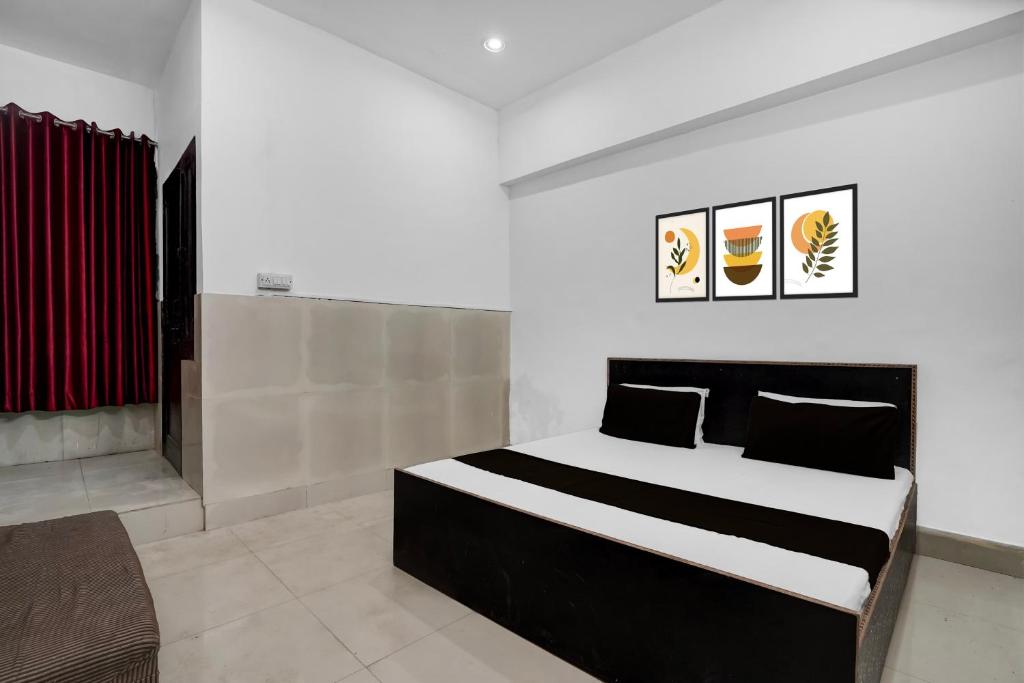 Ένα ή περισσότερα κρεβάτια σε δωμάτιο στο Hotel O Dream Guest House