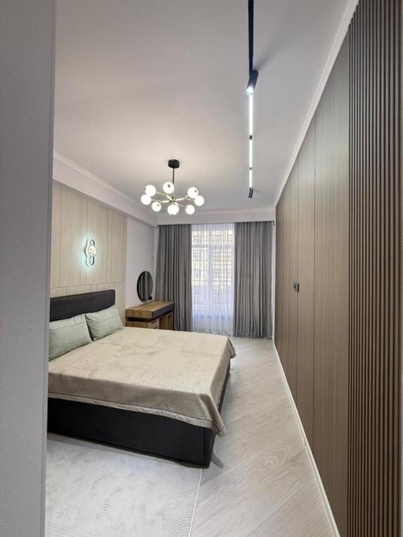 Ένα ή περισσότερα κρεβάτια σε δωμάτιο στο Квартира бизнесс-класса