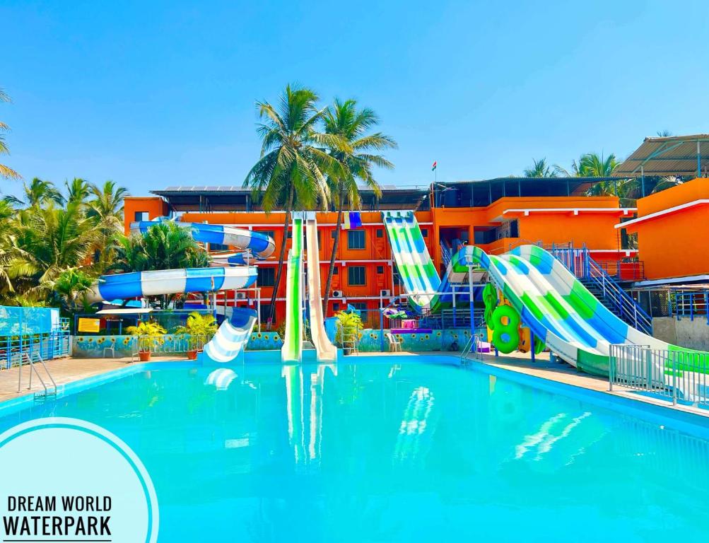 a swimming pool with a water park with slides at Dreamworld Waterpark Resort Virar in Virār