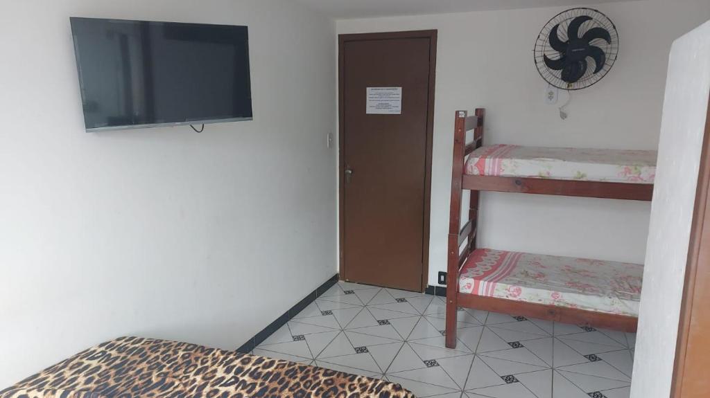 Ένα ή περισσότερα κρεβάτια σε δωμάτιο στο Hotel Silveira