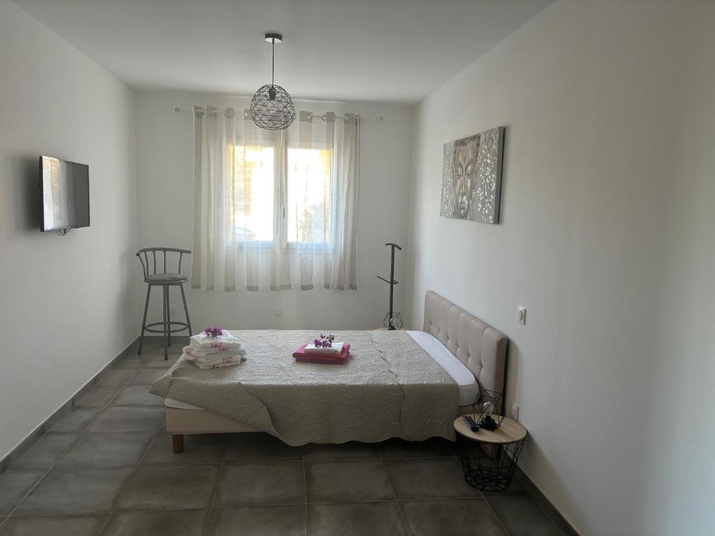 Ένα ή περισσότερα κρεβάτια σε δωμάτιο στο Chez Suzanne