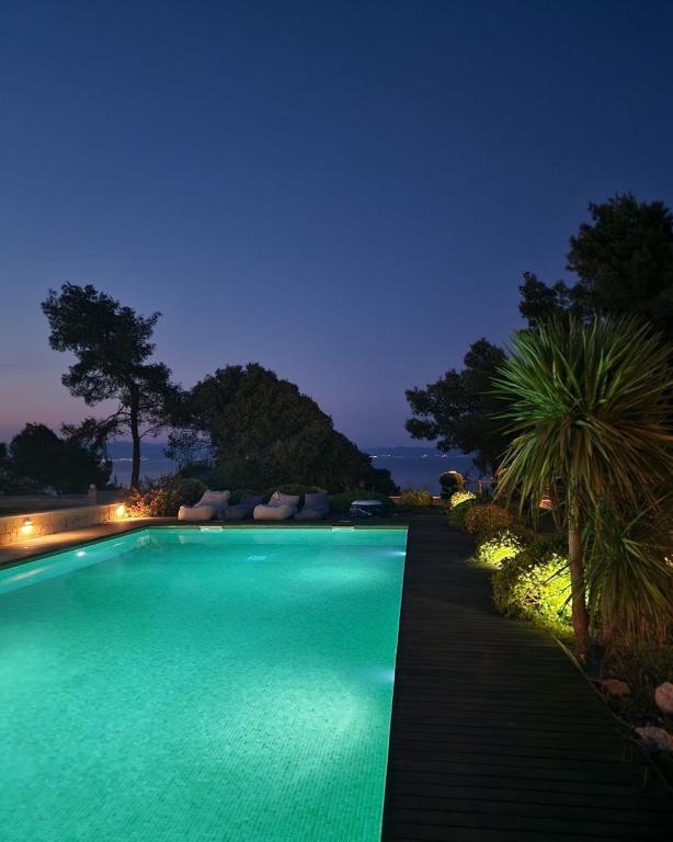 a large swimming pool at night with a pool at Villa Musa with private pool in Afitos