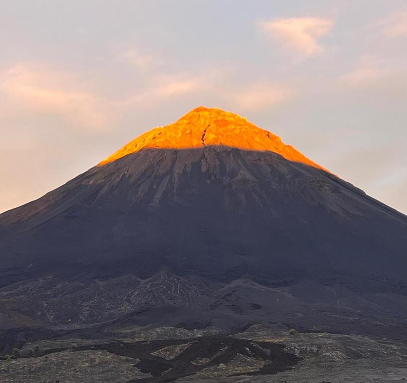 a mountain with a orange top on top of it at Funco Du Santos in Portela