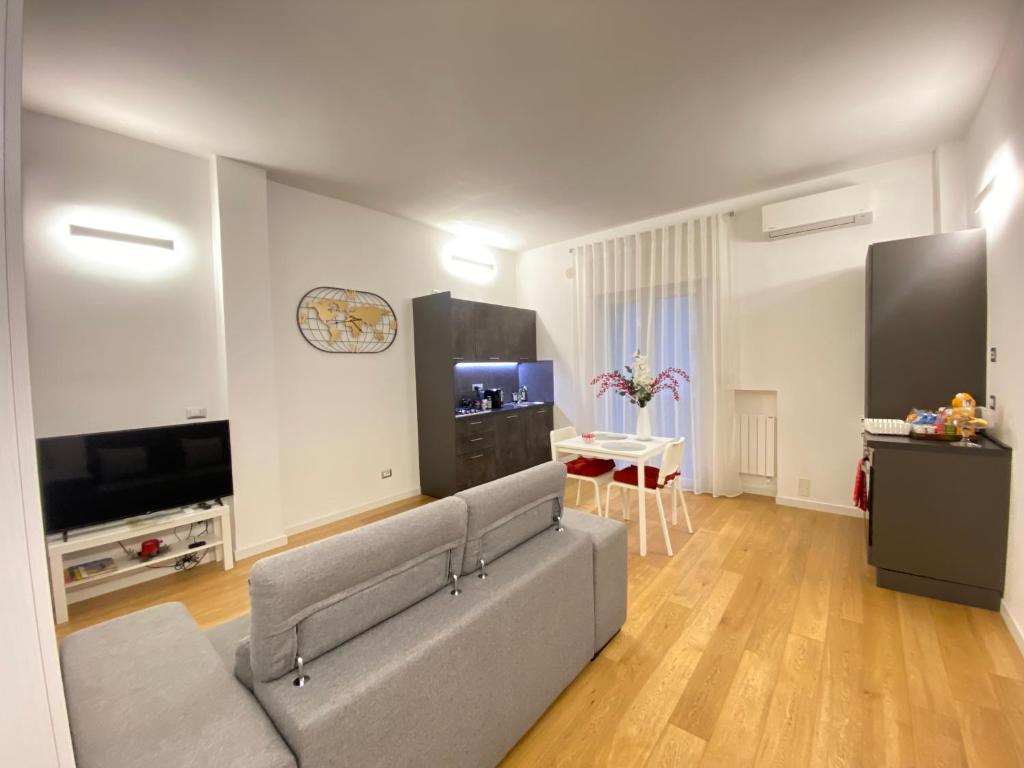 a living room with a couch and a flat screen tv at A&A B&B Piccinni in Bari