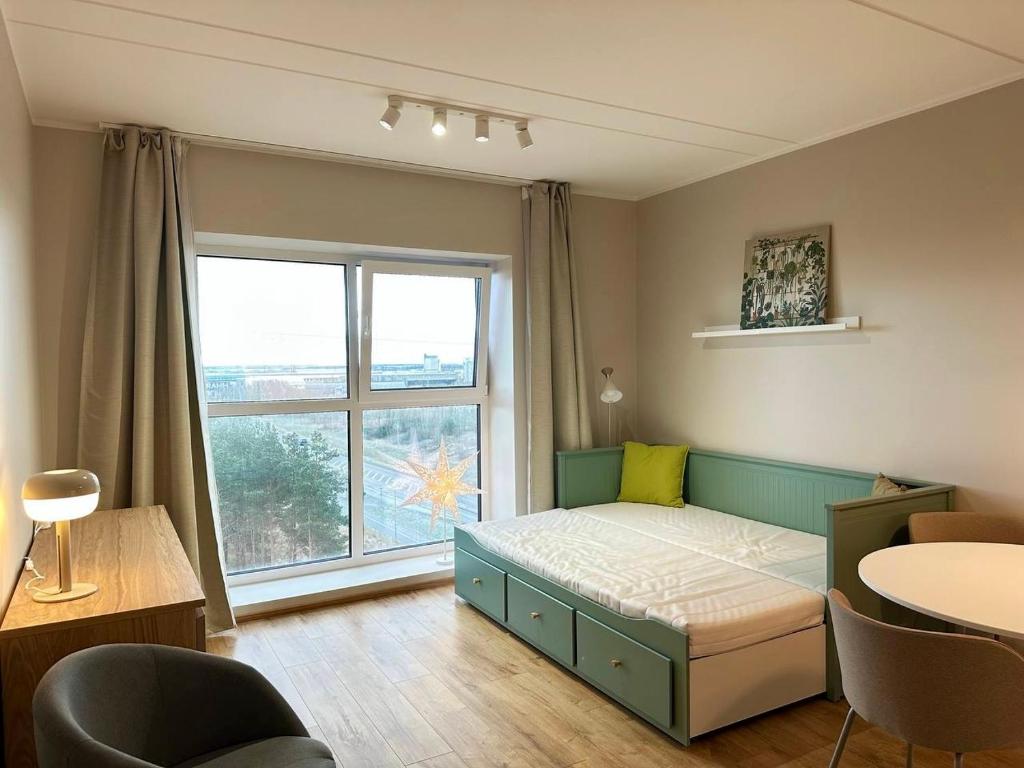 Ένα ή περισσότερα κρεβάτια σε δωμάτιο στο Studio apartment with gym and coworking space